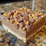 These No-Bake Peanut Butter Bars are rich, creamy, and topped with chocolate! A quick and easy dessert that everyone will love